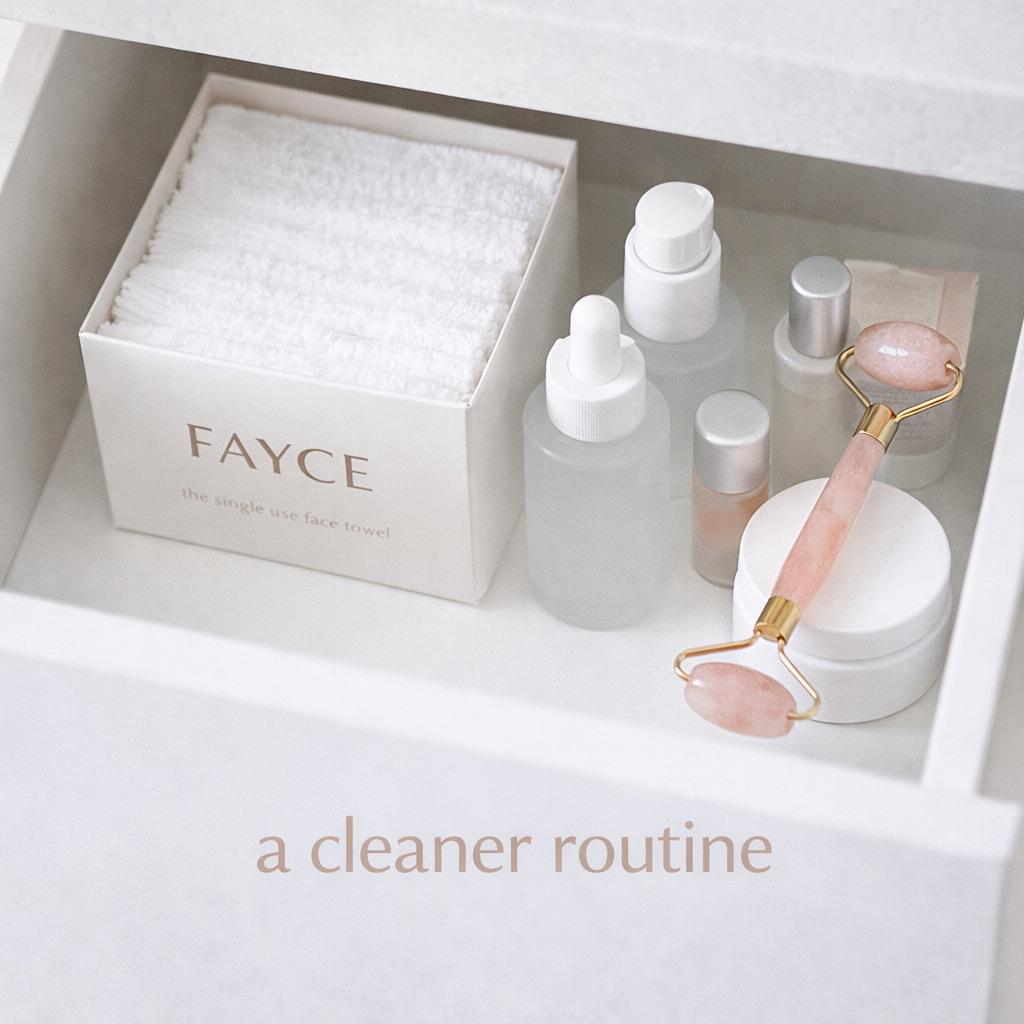 FAYCE disposable face towel box with serum and jade roller in a vanity flatlay