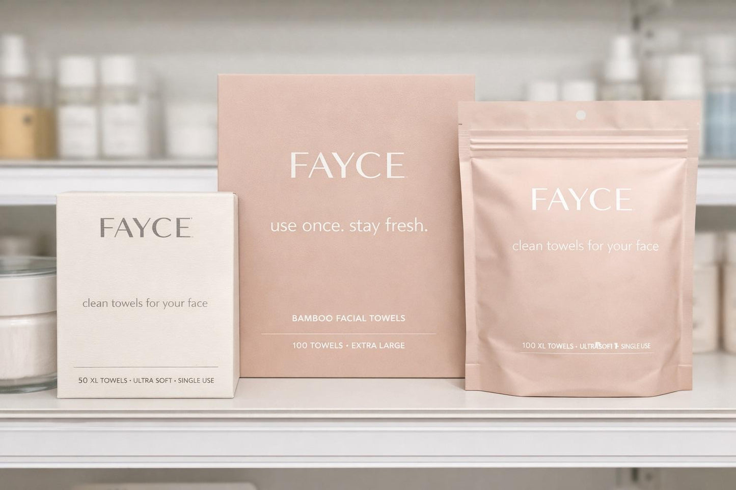 FAYCE disposable face towel box beside two kraft refill pouches on a shelf